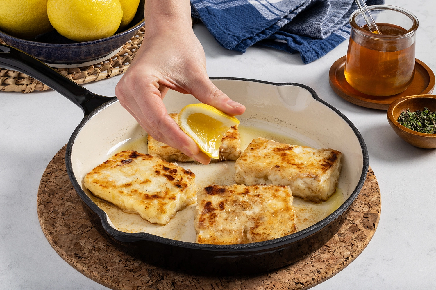 Cheese cooked in a large skillet over medium heat drizzed with lemon juice.