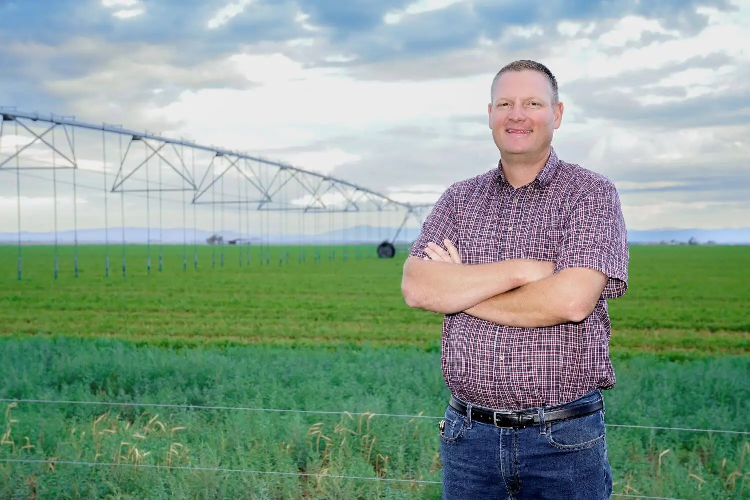 Kimball Holt, a Utah dairy farmer, showing off the Low Energy Precision (LEPA) system for water conservation.