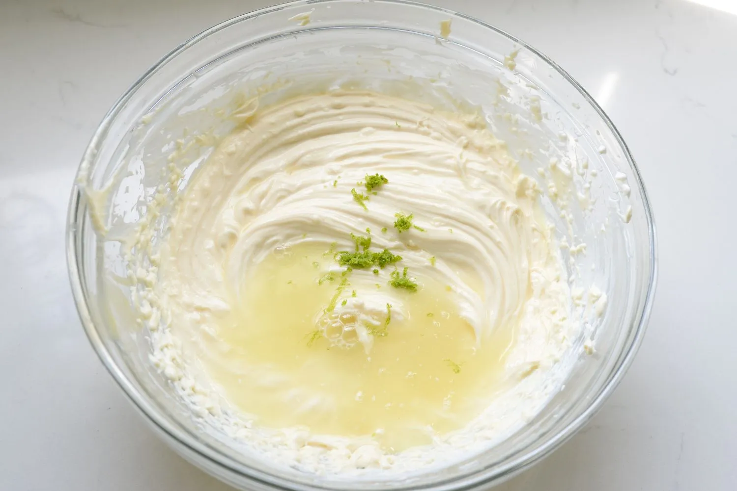 Mini-Key-Lime-Pies-3.jpg Key lime zest and lime juice added to cream cheese, Greek yogurt, and sweetened condensed milk mixture.