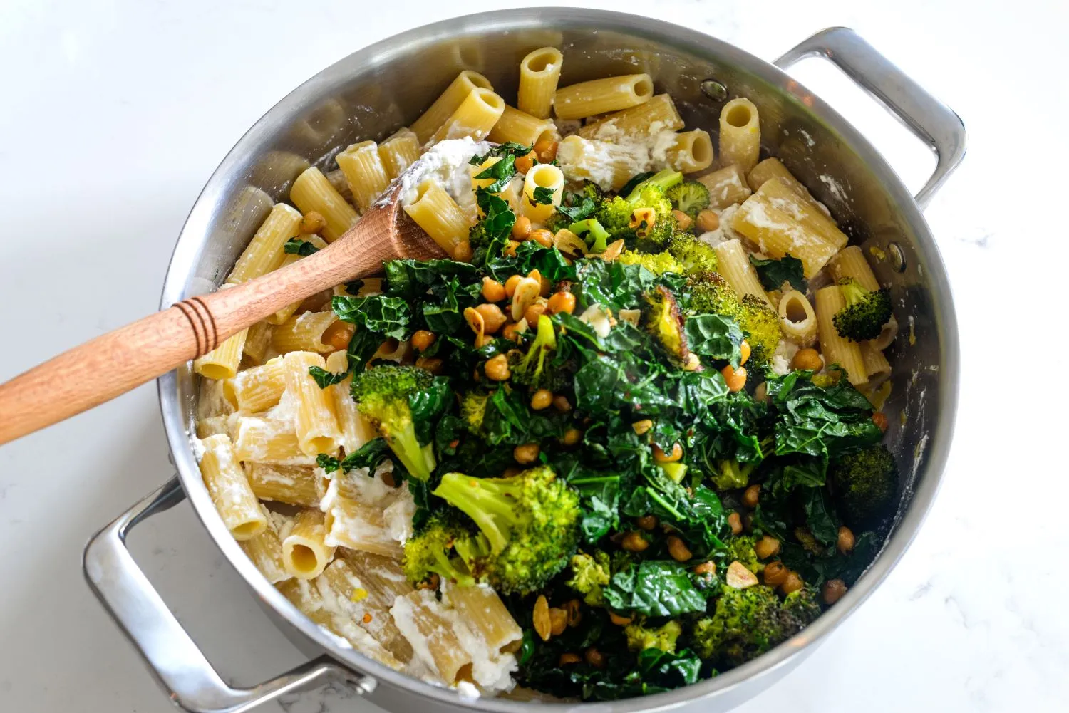 Broccoli, chickpea, and kale mixture with ricotta pasta
