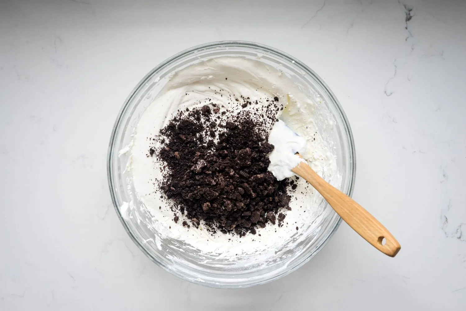 Greek yogurt protein fluff topped with crushed cookies and cream cookies