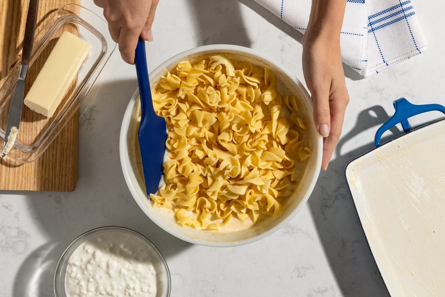 A bowl with the cooked noodles ready to stir into the kugel mixture.