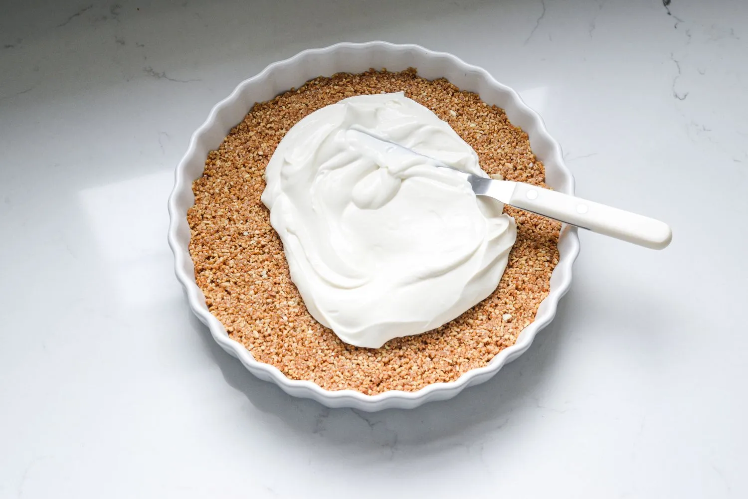 Greek yogurt mixture spread on the chilled tart crust.