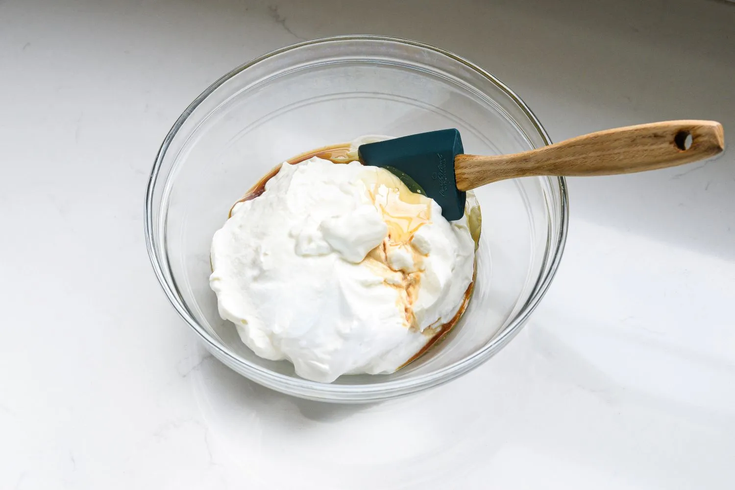 Yogurt, honey, and vanilla in a large bowl.