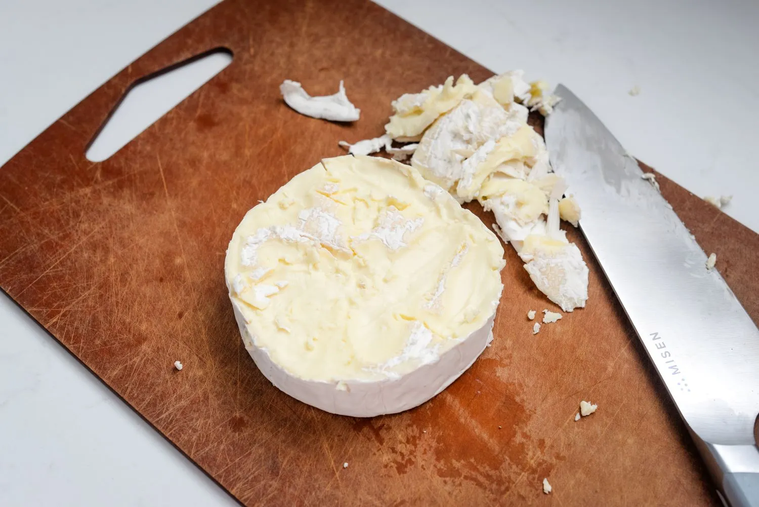 Brie wheel with the rind cut from the top