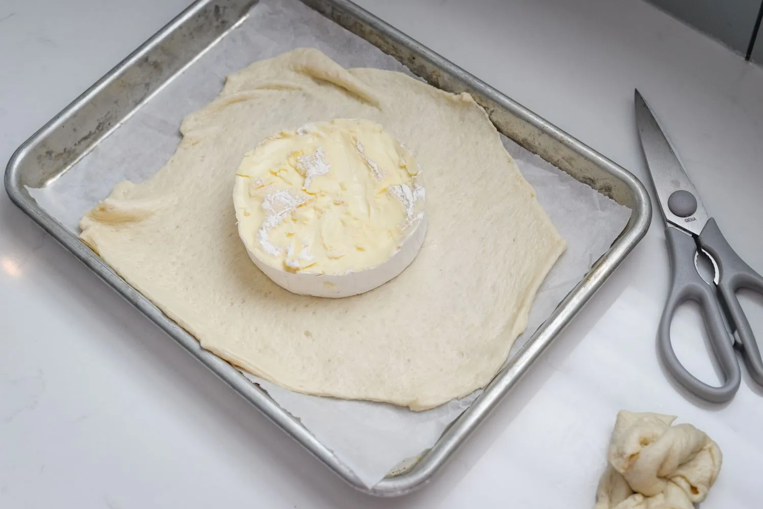 Brie wheel without the rind, placed on the top of pizza crust.