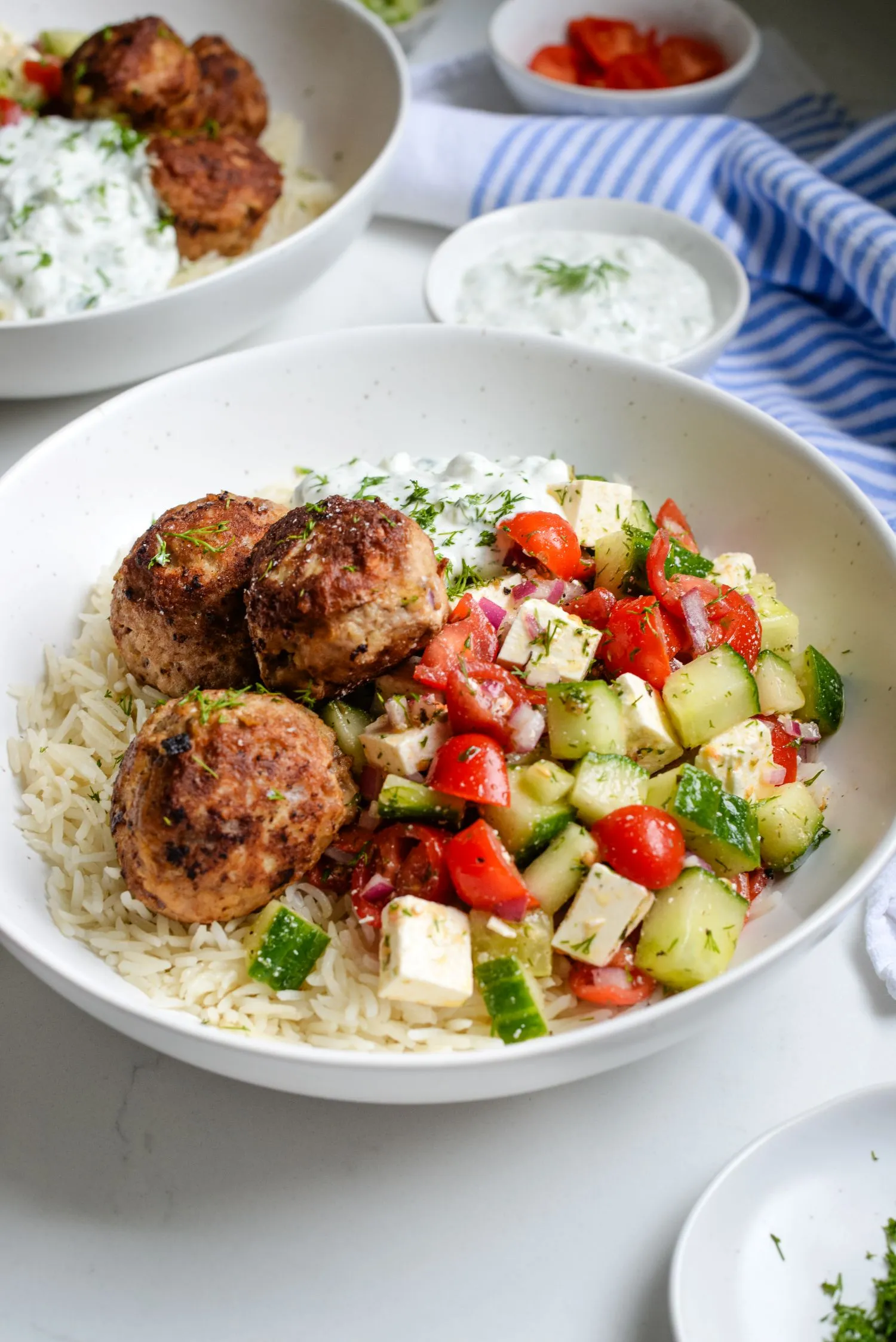 Greek turkey meatballs with tzatziki sauce bowl.
