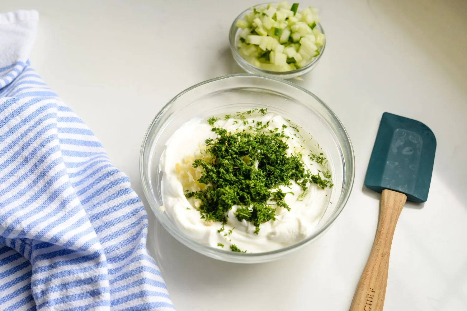 Yogurt, dill, garlic and lemon juice combined to make tzatziki sauce.