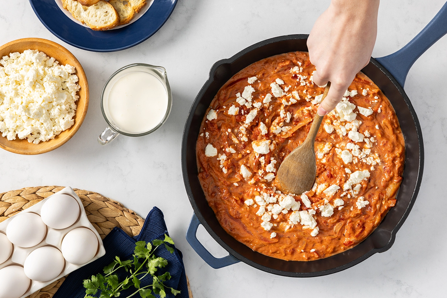 crushed tomatoes and heavy cream seasoned with salt and pepper and stirred in a skillet.
