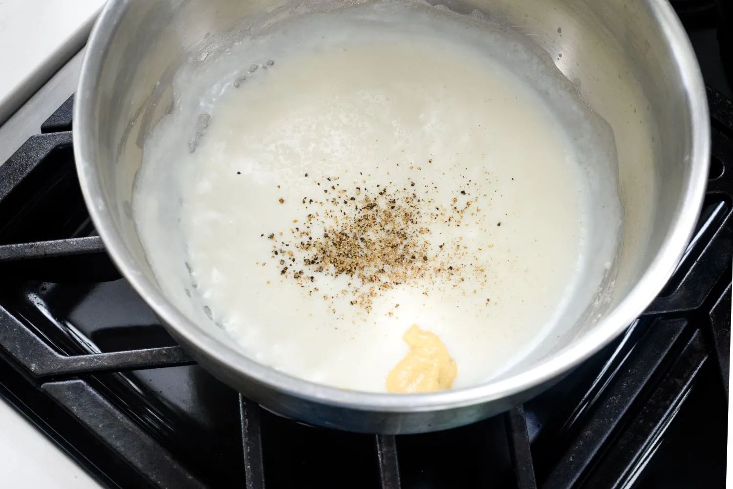 Melted béchamel sauce in a heated pan,