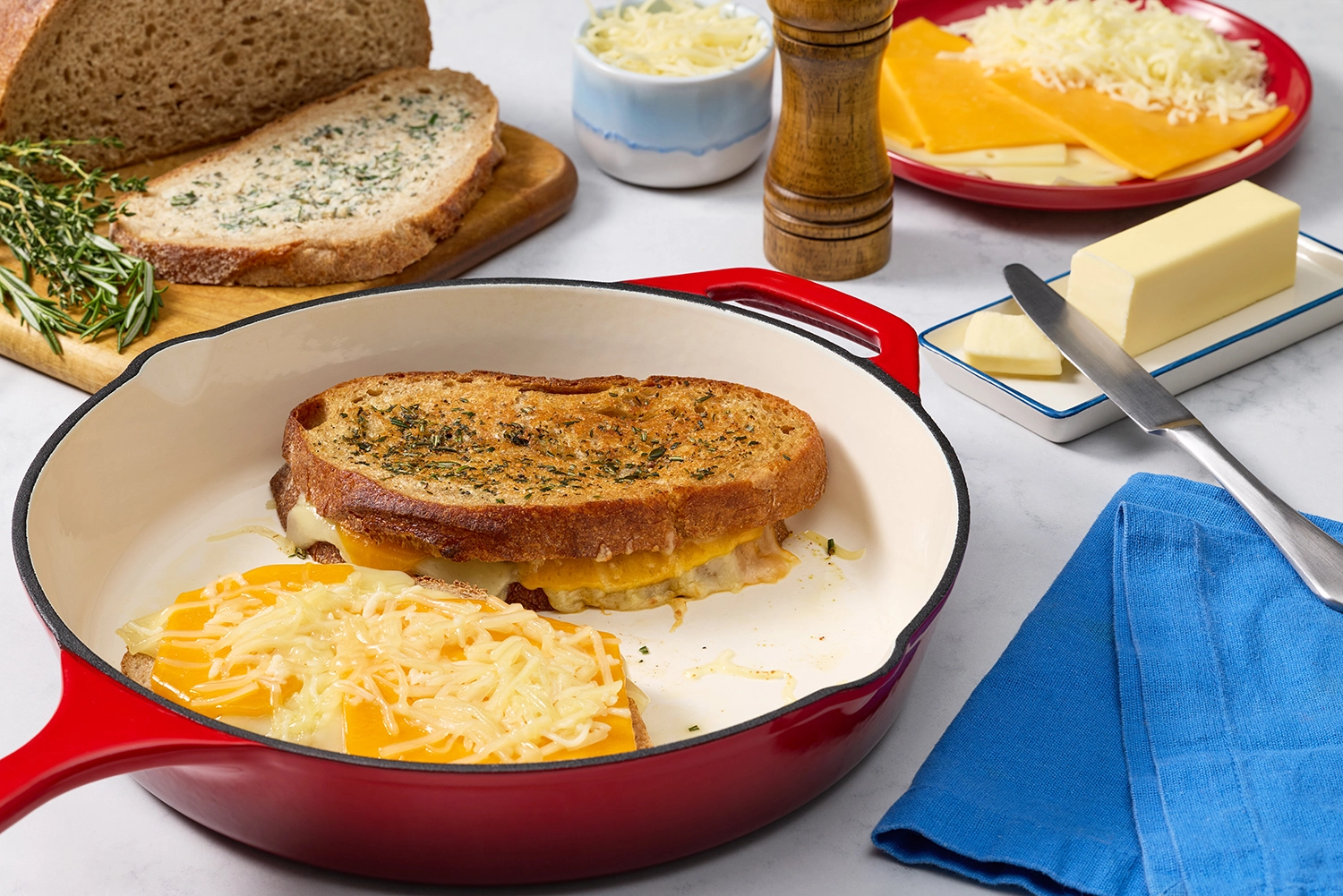 Grilled cheese sandwich cooking in a skillet.